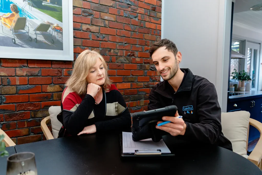 tradesman sitting down with client